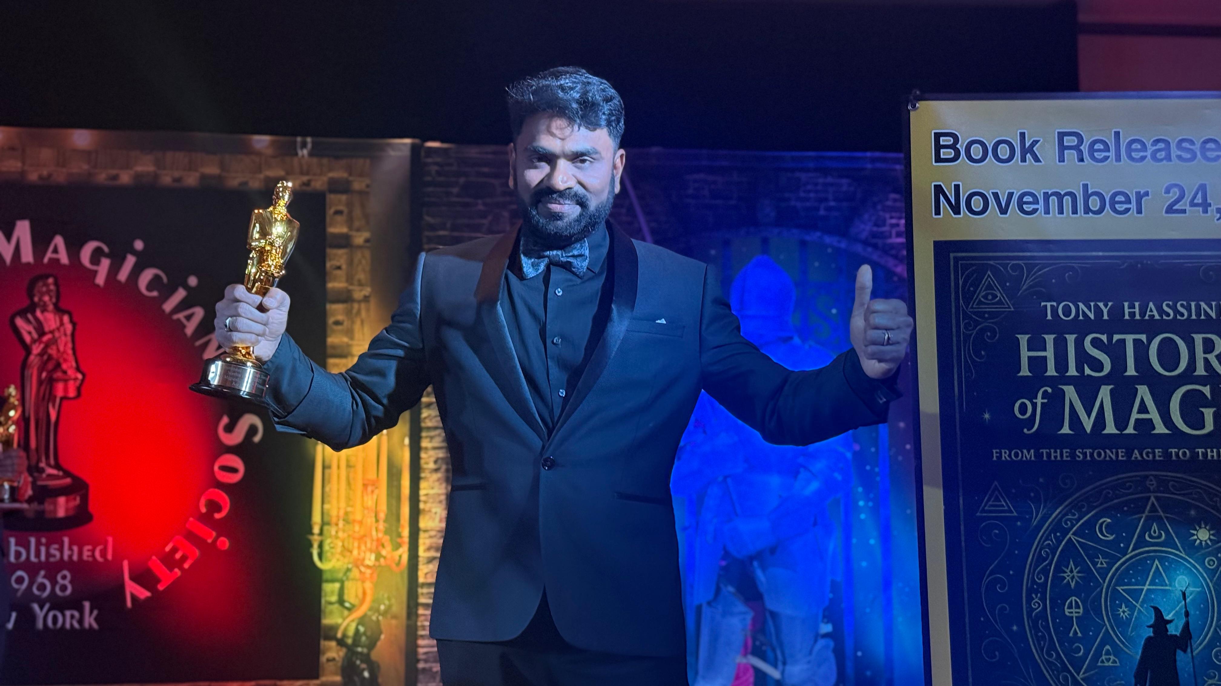 Aravind V.K. receiving an award